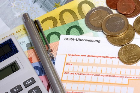 Erlagschein und Münzen